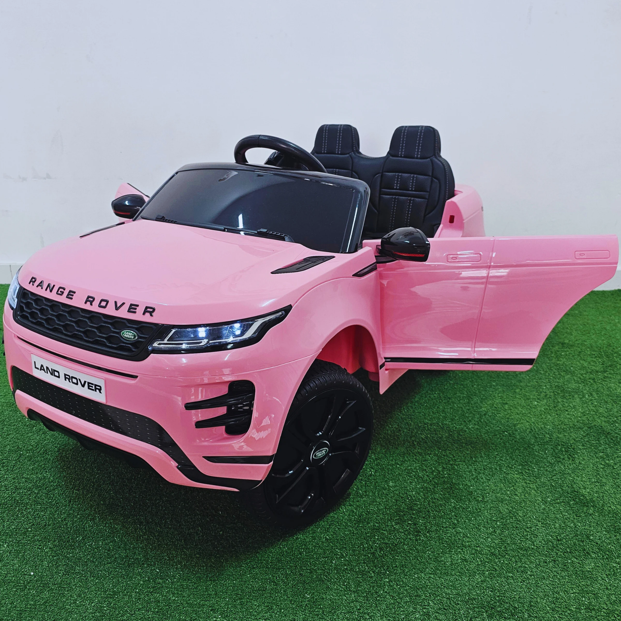 Coche Eléctrico para Niños RANGE ROVER EVOQUE 12v Rosa c/ RUEDAS DE GOMA & ASIENTO DE PIEL